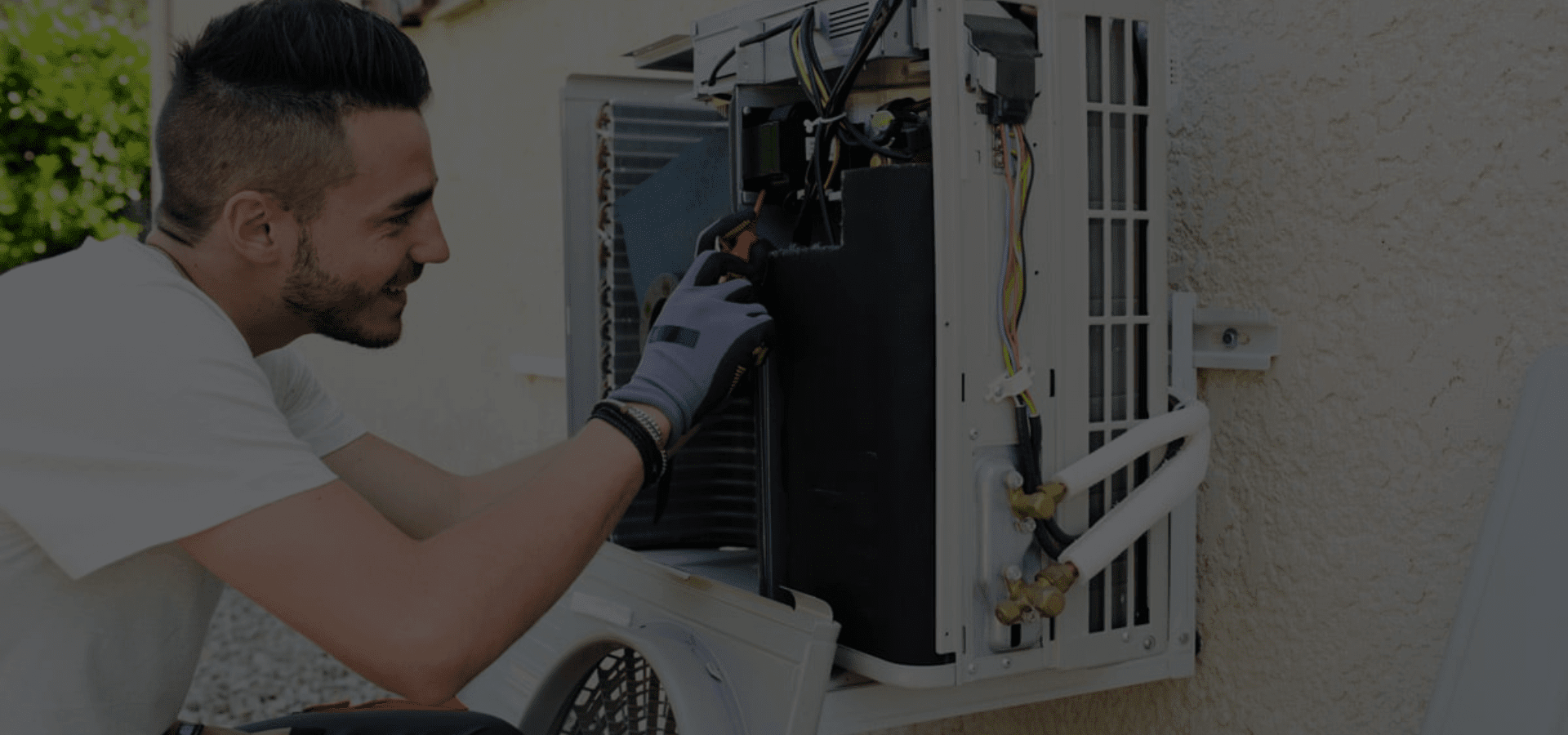 Certified HVAC technicians installing new heating and cooling system.